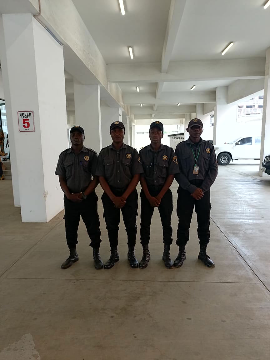 Sarf Guards officers beside a patrol pickup vehicle