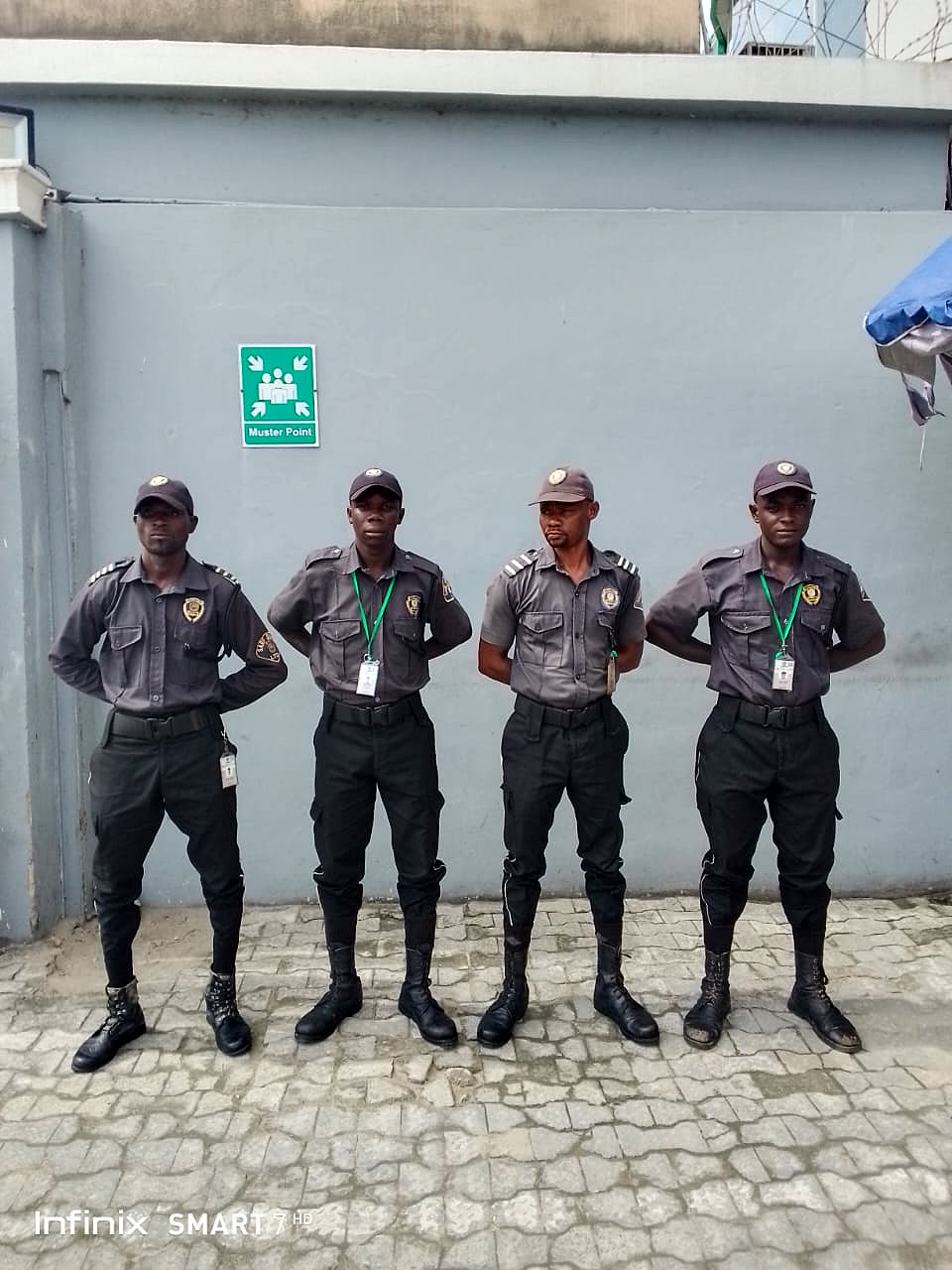 Sarf Guards officers at a facility gate and muster point